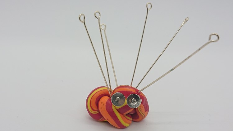 Attach findings to polymer clay